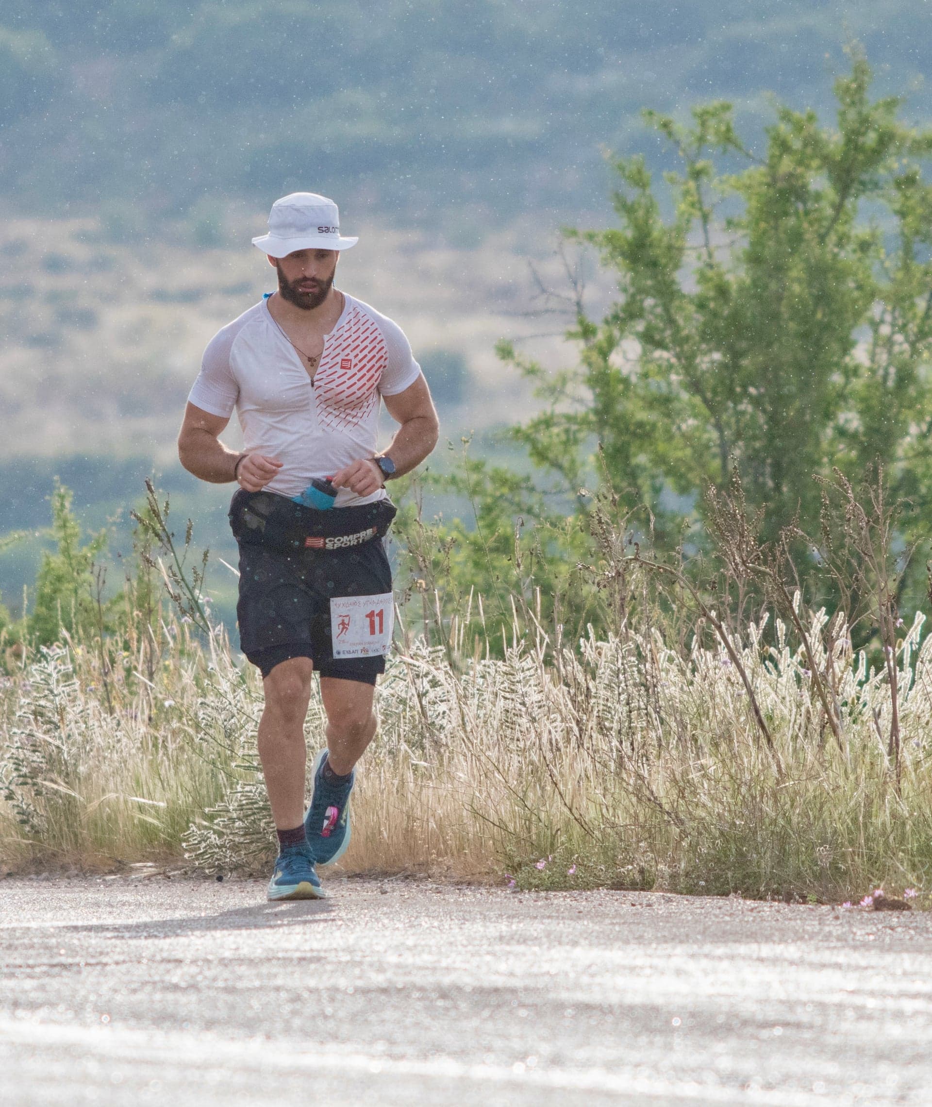 Running coach providing individualized training guidance outdoors