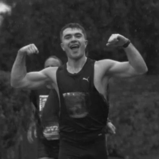 Josh Nye smiling after completing a half marathon